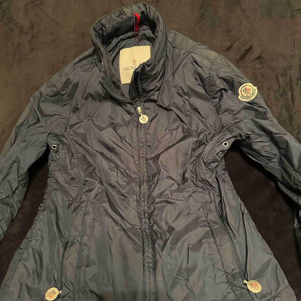 Moncler girls raincoat with rhinestone embellishments on back.